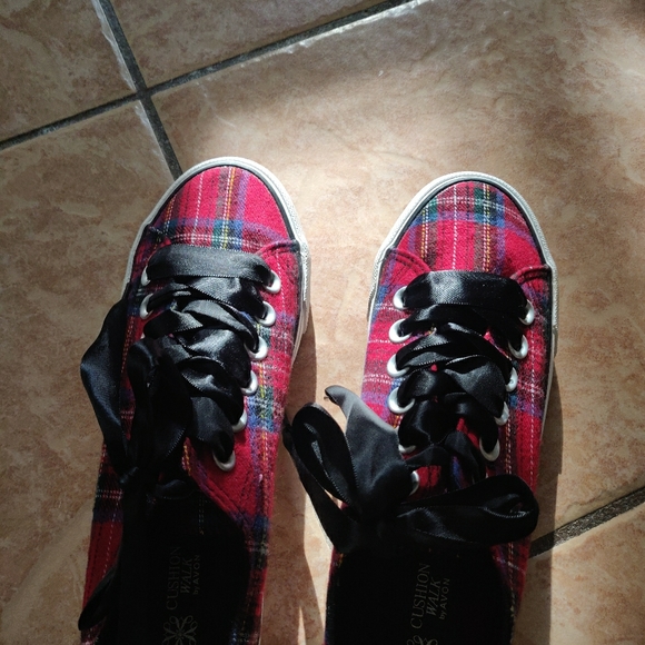 red black and green tennis shoes